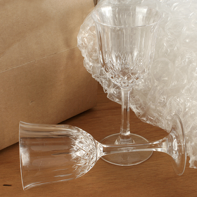 Photo: Packing fragile items. Wine glasses and bubblewrap